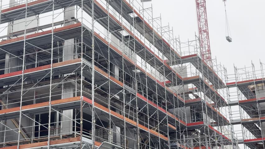 View of a new residential apartment building under construction in Milan, Italy.