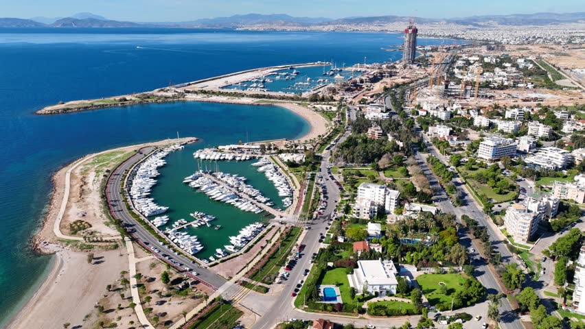Aerial drone cinematic video of famous luxury South area of Glyfada capital's best-known nightclubs, upscale restaurants and shops, Athens Riviera, Attica, Greece