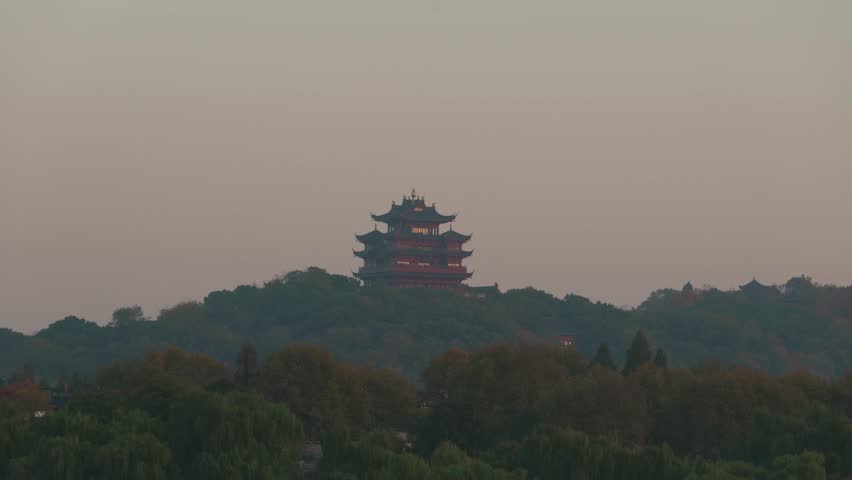 A distant view of the Chenghuang Pagoda, located on a hill overlooking the West Lake in Hangzhou,