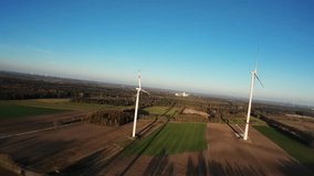 Aerial Midday Wind Turbine Field With Crisp Blue Sky, Drone Inspection Captures Blade Motion And Tower Details, Engineer Monitors Remote Sensors, Grid Technician Checks Connection, Harvested - Powered by Shutterstock - Get 15% off with code: PIKWIZARD15