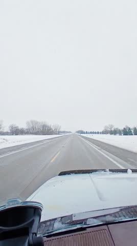 Portrait of a car driver on a snowy road in Hutchinson, Minnesota, USA