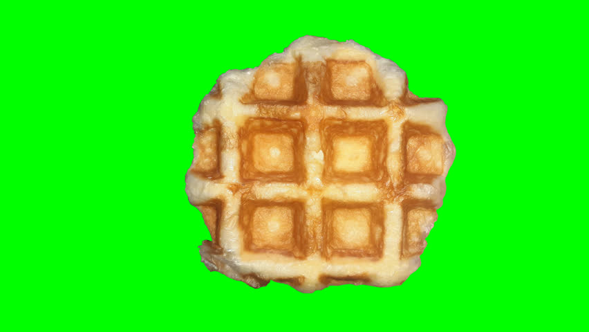 A single waffle on a green screen background.