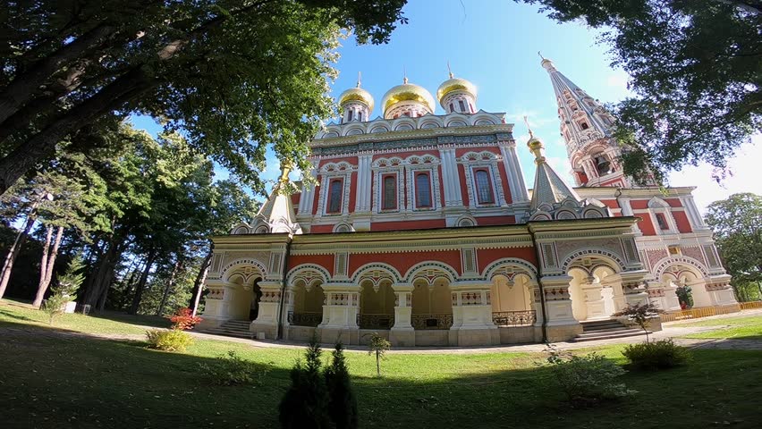 A handheld low-angle video of the Shipka Memorial Church, capturing its exterior and surroundings in the foothills of the Shipka Pass, BG, EU, 01 Sept. 2019