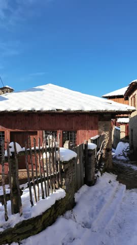Winter Sunset view of Village of Kovachevitsa with Authentic nineteenth century houses, Blagoevgrad Region, Bulgaria