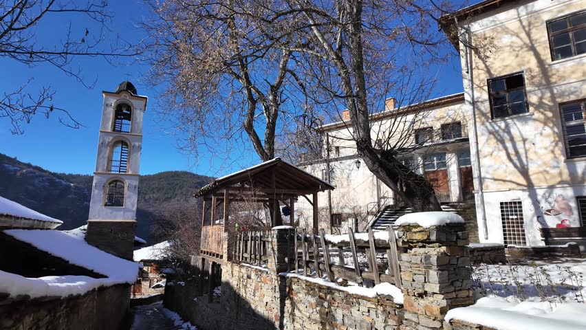Winter Sunset view of Village of Kovachevitsa with Authentic nineteenth century houses, Blagoevgrad Region, Bulgaria