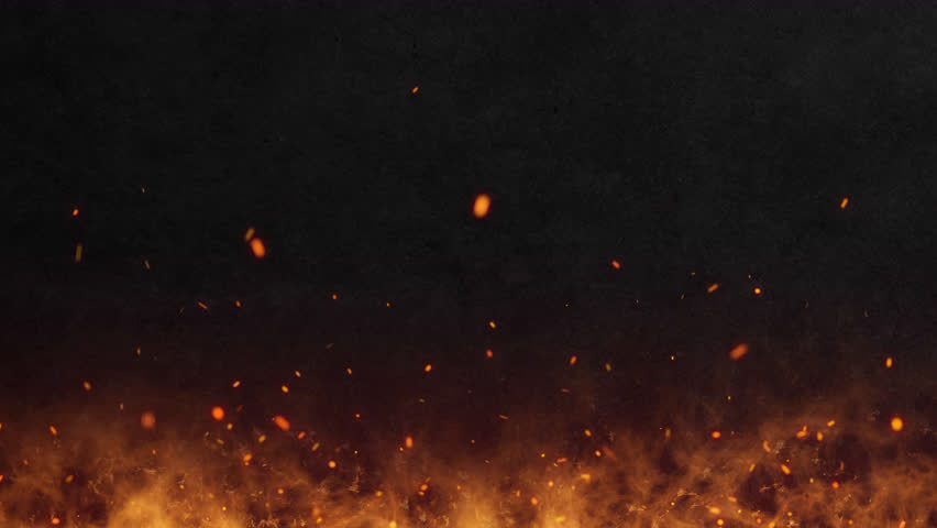 Abstract orange fiery sparks and smoke from a bonfire with fire, abstract background.