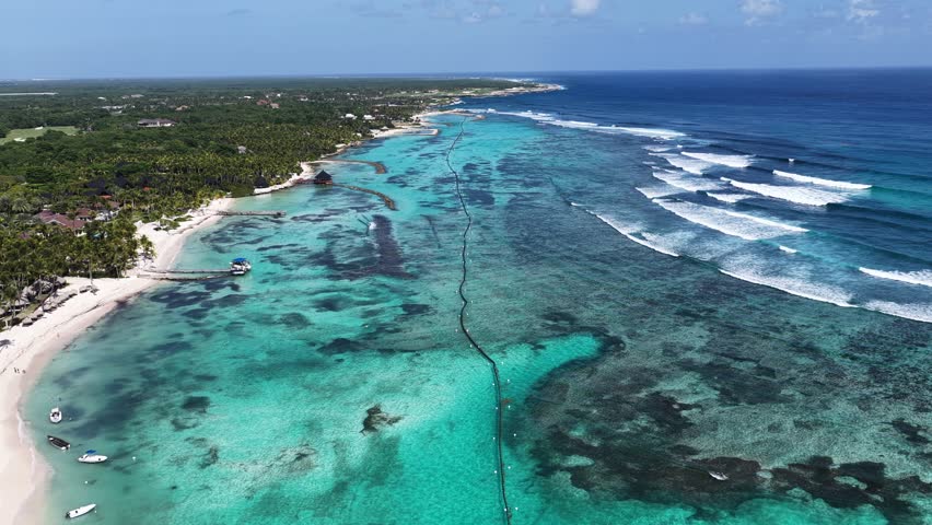 Playa Blanca Beach In Punta Cana La Altagracia Dominican Republic. Stunning Tropical Coastline Beach Scene Viewed From Above. Shore Sky Clouds Beach Sea. Seaside Scenic Coastline.