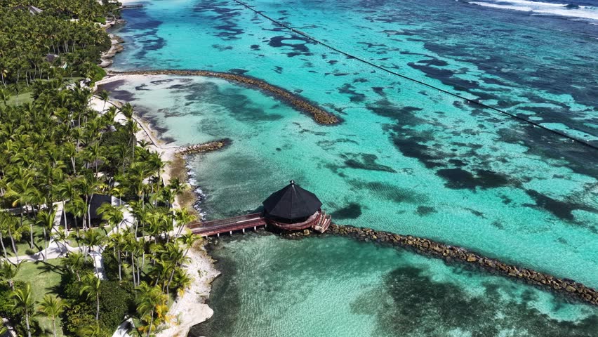 Punta Cana Skyline In Punta Cana La Altagracia Dominican Republic. Aerial View Of Stunning Beach With Crystal Clear Waters. Coast Clouds Seaside Summertime. Seaside Beach Panning Wide.