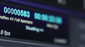 A close-up shot shows a computer screen with a video editing software interface. A cursor highlights various output options and settings, showcasing the technical aspects of digital media production. - Powered by Shutterstock - Get 15% off with code: PIKWIZARD15