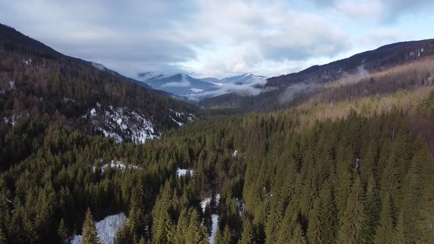 Drone View of Snow-Capped Mountain Wilderness in Winter