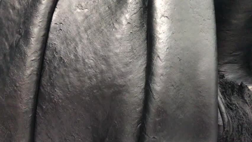 The rubber open mill is subjected to mastication for a homogeneous mixture.