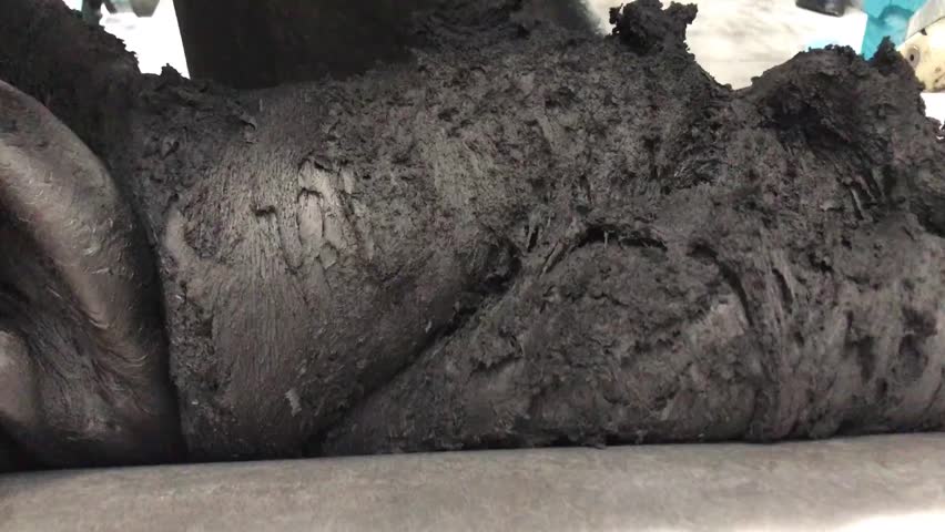 The rubber open mill is subjected to mastication for a homogeneous mixture.