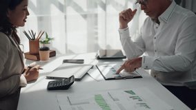 Business colleagues analyzing financial charts and graphs during a meeting. Professionals discussing company performance and strategy - Powered by Shutterstock - Get 15% off with code: PIKWIZARD15
