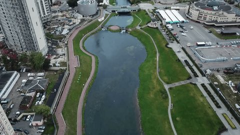 Forward Aerial View along Urban River Corridor