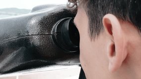 a man looking through binoculars - Powered by Shutterstock - Get 15% off with code: PIKWIZARD15