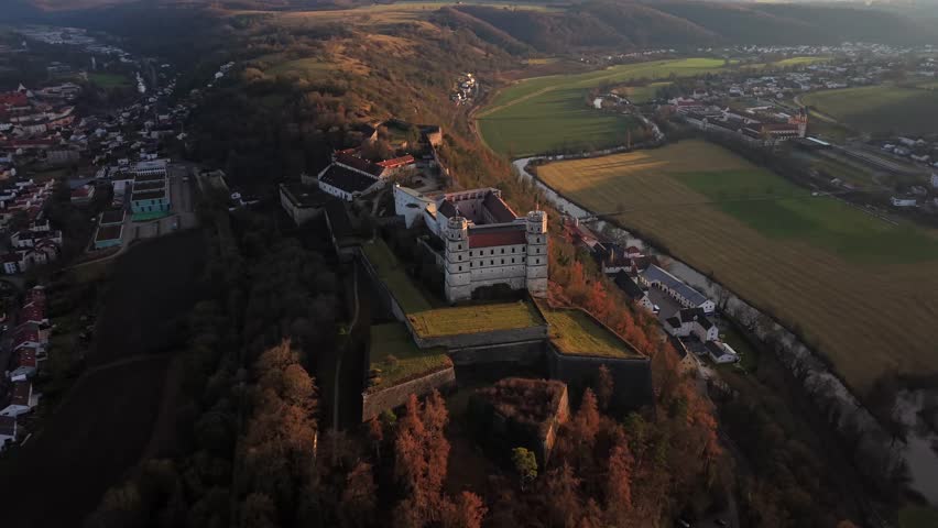 Drone aerial view of Willibaldsburg Castle, Eichstaett, Bavaria, Germany. Medieval fortified castle on a hill spur, featuring bastions, towers, museums, and scenic views of nature and city.