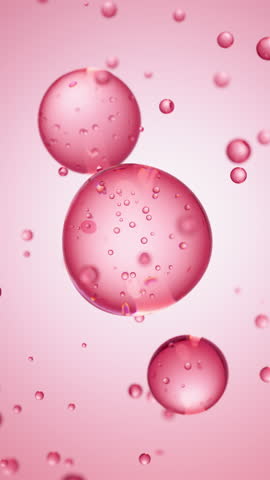 Macro of three drops of red liquid merge into one with bubbles inside. Skin care serum droplets uniting into one. Cosmetics moisturizer fluid concept Vertical video