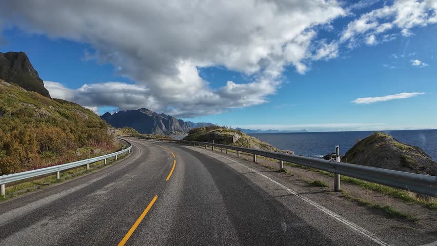 Point of view shot driving along a spectacular coastal road in Reine, Norway