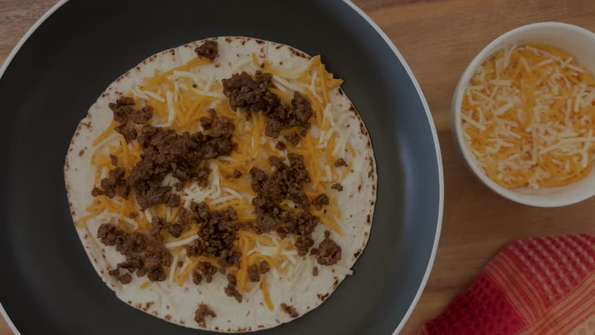 Making a Beef and Cheese Quesadilla Shot From Above