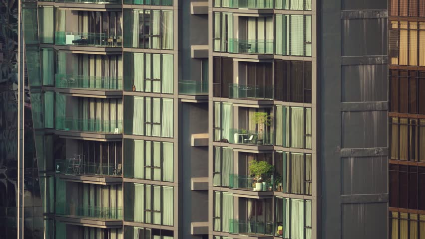 Aerial view of apartments in Bangkok with balcony details and urban setting