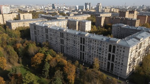 Aerial Diagonal Flight above City Buildings