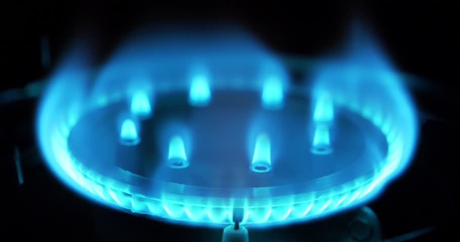 Blue flames of burning gas of gas stove