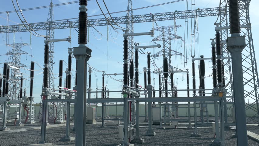 Real-time footage of a 220kV busbar disconnect switch closing at a high-voltage substation. The video captures the mechanical connection, visible electric arcs (plasma pre-strike), and the distinct crackling sound of high-voltage electricity. Original audio included.