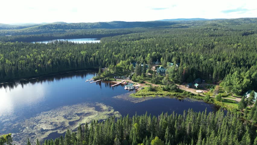 Aerial view of Triton in Quebec, serene lake and dense forest landscape