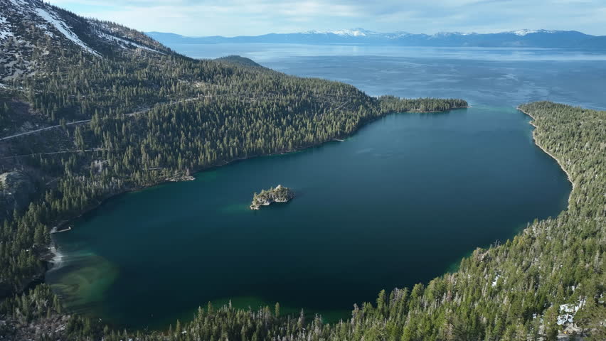 Aerial view circling the Emerald bay, snowy, winter day at Lake Tahoe, USA