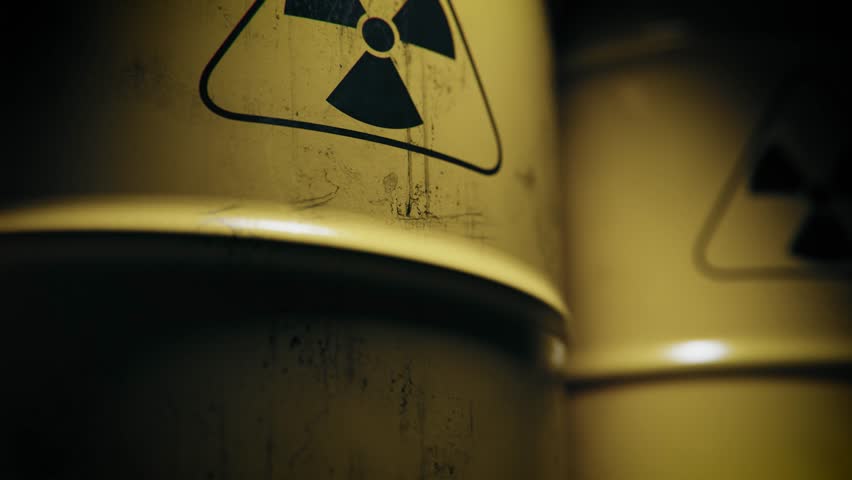 Close Up Radioactive Symbol on Grungy Yellow Barrel