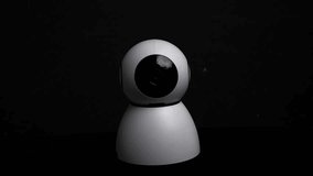 Modern CCTV security camera isolated on a black background, representing surveillance, privacy, and safety monitoring - Powered by Shutterstock - Get 15% off with code: PIKWIZARD15