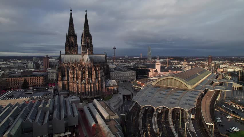 Köln or Cologne Germany, beautiful aerial cityscape with Kolner Dom Cathedral and HBF train station, cinematic 4K drone shot.