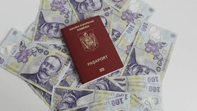 Romanian European Union biometric passport with boarding pass against a white background with Romanian Lei cash money - Powered by Shutterstock - Get 15% off with code: PIKWIZARD15