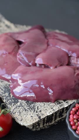 Raw fresh chicken or turkey liver, internal offal of poultry as an ingredient for cooking. Raw chicken liver as a food background
