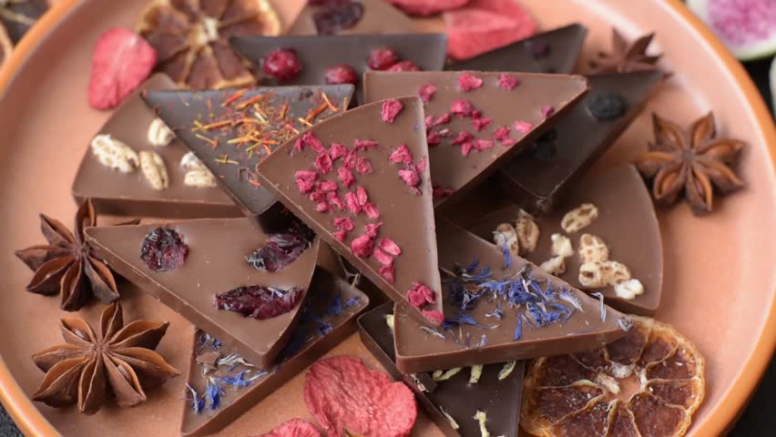 Craft home made chocolate with berries and fruits, delicious sweets. Craft chocolate as food background