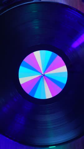 Vertical View, Spinning Vinyl Record on Turntable, Starting Playback of Long Play Recording, Close Up