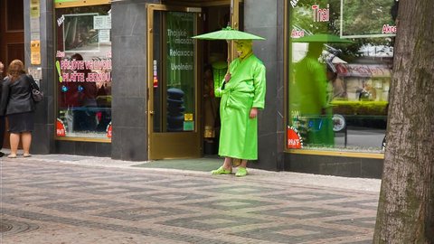 PRAGUE, CZECH REPUBLIC - MAY 21, 2013: Man dressed as Shrek is standing in front of the thai massage in Prague