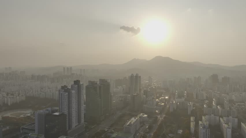 Aerial view over Pyeongchon and Beomgye area at sunset in Anyang City, South Korea