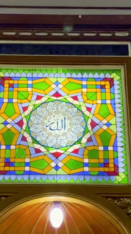 Colorful stained glass in mosque ceiling
