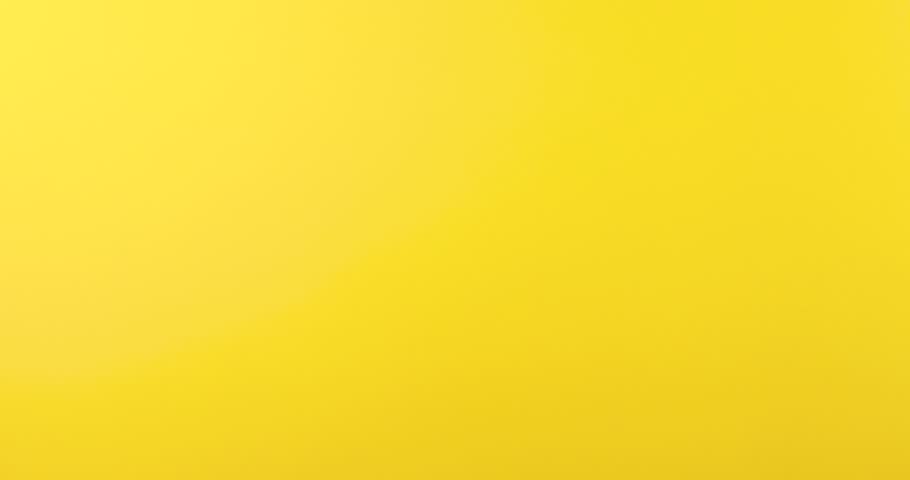 4K stock footage of a hand making a V sign gesture, symbolizing victory or peace, against a bright yellow background. Clean and vibrant, this video is perfect for presentations, social media, advertising, motivational content, or creative projects. The minimalist background emphasizes the gesture, making it versatile for various professional and artistic uses