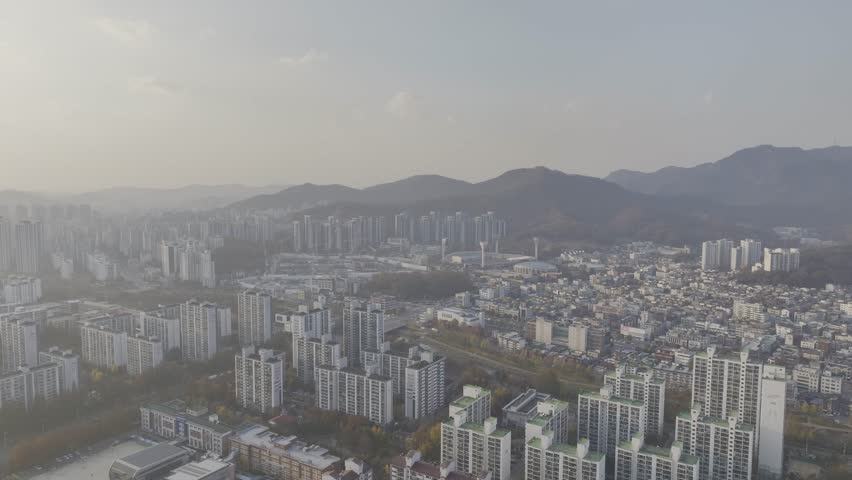 Aerial view over Pyeongchon and Beomgye area at sunset in Anyang City, South Korea