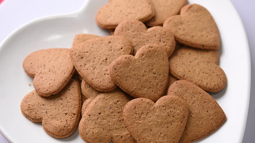 Heart Shaped Valentine Cookies Rotating on Plate