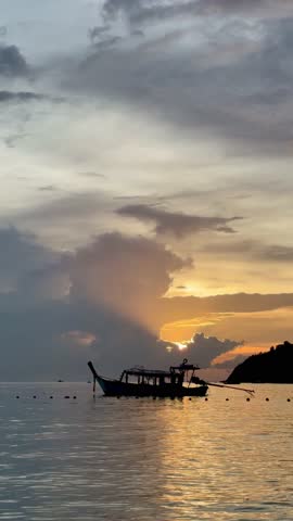 Spectacular sunset with boats in the sea, Koh Lipe, Thailand