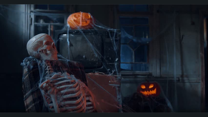 Spooky Halloween scene with a human skeleton, carved glowing pumpkins, and spider webs in a dark room.