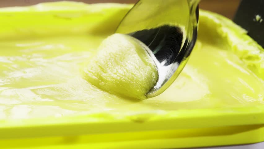 Scooping Margarine with a spoon.