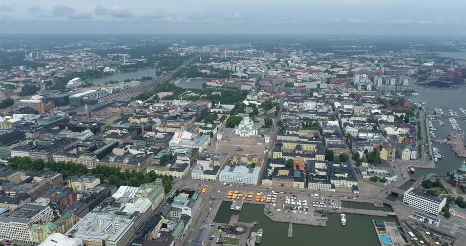 Helsinki Downtown Cityscape, Finland. Cathedral Square, Market Square, Sky Wheel, Port, Harbor in Background. Drone Point of View