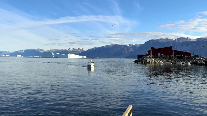 Greenland, Uummannaq. A ship is arriving at the port
