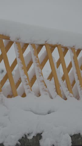 Snow Falling on Wooden Fence, Winter Texture Background 4K