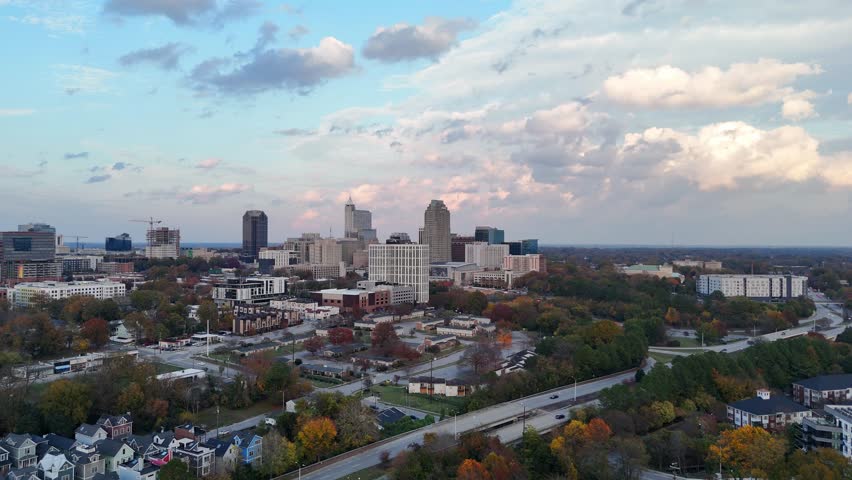 Drone view of downtown Raleigh surrounded by residential areas and city roads.