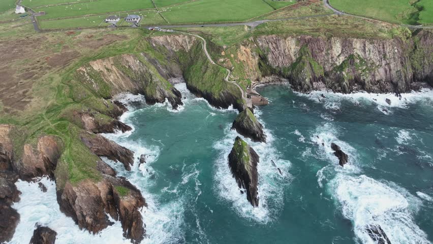 Wild places Ireland Dingle Slea Head Kerry Winter Atlantic storm at Dounquin Pier popular tourist spot and destination